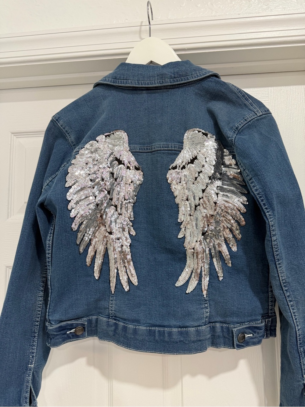 VENUS Women's Classic Blue Denim Jacket with Wings on back.